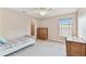 Comfortable bedroom with a bright window and carpeted floors, featuring a ceiling fan at 812 Seneca Meadows Rd, Winter Springs, FL 32708