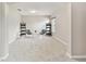 Bright bonus room featuring neutral walls, plush carpeting, and stylish decor, providing a cozy and inviting space at 812 Seneca Meadows Rd, Winter Springs, FL 32708