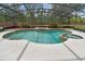 Inviting screened-in pool with an attached hot tub, surrounded by brick accents and manicured landscaping at 812 Seneca Meadows Rd, Winter Springs, FL 32708