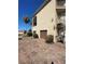 Home exterior with a brick driveway, two-car garage, palm tree, and spiral staircase at 8250 Cherry Lake Rd, Groveland, FL 34736
