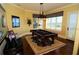Bright game room featuring a billiard table, hardwood floors, and large windows with scenic views at 8250 Cherry Lake Rd, Groveland, FL 34736