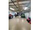 Spacious garage with ample room for parking and storage with epoxy floors at 8250 Cherry Lake Rd, Groveland, FL 34736
