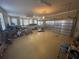 Spacious garage with multiple doors and extra storage space at 8250 Cherry Lake Rd, Groveland, FL 34736