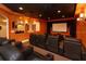 Home theater featuring tiered seating, a large screen, and ambient lighting at 8250 Cherry Lake Rd, Groveland, FL 34736