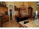 Gourmet kitchen boasting custom cabinetry, granite counters, and stainless steel appliances at 8250 Cherry Lake Rd, Groveland, FL 34736
