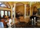 Open living area with cathedral ceiling, ornate columns, and lots of natural light at 8250 Cherry Lake Rd, Groveland, FL 34736