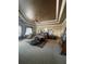Main bedroom with a tray ceiling, a ceiling fan, and a cozy sitting area at 8250 Cherry Lake Rd, Groveland, FL 34736