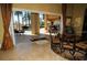 Dining area that opens to a screened patio with swimming pool and outdoor entertaining area at 8250 Cherry Lake Rd, Groveland, FL 34736