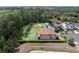 Aerial view of home, large lot, and surrounding wooded area with marked property lines at 8478 Elba Isle Ct, Windermere, FL 34786