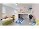 Cozy bedroom featuring a unique bunkbed with lofted bed, dresser, and plush furnishings at 8478 Elba Isle Ct, Windermere, FL 34786