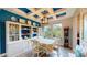 Beautiful dining room with a coffered ceiling, built-in storage, and a view to the outdoors at 8478 Elba Isle Ct, Windermere, FL 34786