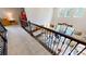Upstairs hallway overlooking the living room with soaring ceilings and a wall of windows at 8478 Elba Isle Ct, Windermere, FL 34786