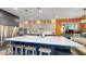 Beautiful kitchen with a large island, modern appliances, stylish pendant lighting, and custom cabinets at 8478 Elba Isle Ct, Windermere, FL 34786