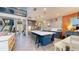 Open-concept kitchen features a large island with seating, pendant lighting, and stainless steel appliances at 8478 Elba Isle Ct, Windermere, FL 34786