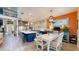Kitchen and dining area offers a bright open space with modern appliances and an island with bar stool seating at 8478 Elba Isle Ct, Windermere, FL 34786