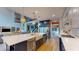 Gourmet kitchen boasts a large island, stainless appliances, and opens to a dining area and living space at 8478 Elba Isle Ct, Windermere, FL 34786