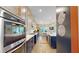 Spacious kitchen with a long island, stainless steel appliances, and modern finishes at 8478 Elba Isle Ct, Windermere, FL 34786