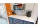 Close-up of a kitchen counter with modern appliances and stylish cabinetry at 8478 Elba Isle Ct, Windermere, FL 34786