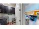 Laundry Room leading into the large living room and open kitchen at 8478 Elba Isle Ct, Windermere, FL 34786