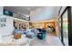 Spacious living room with sofa, a view of the kitchen island, and the staircase at 8478 Elba Isle Ct, Windermere, FL 34786