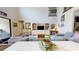 Comfortable living room featuring a soaring ceiling, second-floor balcony and built-in shelving for storage and display at 8478 Elba Isle Ct, Windermere, FL 34786