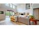 Bright living room with high ceilings, tile floors, and sliding glass doors leading to outdoor patio at 8478 Elba Isle Ct, Windermere, FL 34786