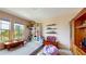 This playroom features built in shelving, lots of space, and natural light at 8478 Elba Isle Ct, Windermere, FL 34786