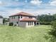 A vast, well-maintained lawn complements this home's exterior, offering an ideal outdoor space at 8478 Elba Isle Ct, Windermere, FL 34786
