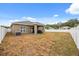 Spacious backyard with room for outdoor activities and entertainment, and an enclosed patio at 849 Avenal Ln, Davenport, FL 33837