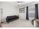 Cozy bedroom with stylish decor, including a black futon and industrial shelves at 849 Avenal Ln, Davenport, FL 33837