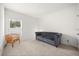 This room features plush carpet, a large window for natural light, and neutral paint at 849 Avenal Ln, Davenport, FL 33837