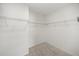 Walk-in closet with wire shelving and carpet flooring at 849 Avenal Ln, Davenport, FL 33837