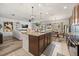 Open-concept living space with a view of the dining area, kitchen island and outdoor area at 849 Avenal Ln, Davenport, FL 33837