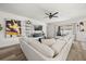 Spacious living room featuring plush seating, contemporary decor, and a sliding glass door at 849 Avenal Ln, Davenport, FL 33837