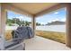 Covered patio offering relaxing outdoor living space overlooking the backyard at 849 Avenal Ln, Davenport, FL 33837