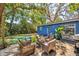 Inviting backyard with patio seating and lush landscaping, perfect for outdoor enjoyment at 8619 Veridian Dr, Orlando, FL 32810