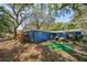 Spacious backyard with a patio, barbecue, and well-maintained lawn at 8619 Veridian Dr, Orlando, FL 32810