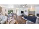 Open concept living and dining area with hardwood floors and contemporary furnishings at 8619 Veridian Dr, Orlando, FL 32810