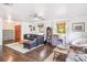 Well-lit living room with hardwood floors, a comfortable sofa, and stylish decor at 8619 Veridian Dr, Orlando, FL 32810