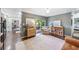 Bright living room with area rug, slider to the backyard, and views into other rooms at 8619 Veridian Dr, Orlando, FL 32810