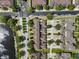 An aerial view showcases this neighborhood's charming townhomes, lush landscaping, and a peaceful community setting at 9009 Savannah Julip Ln, Orlando, FL 32832