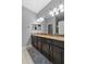 Bathroom with granite countertops and dual sinks at 9009 Savannah Julip Ln, Orlando, FL 32832
