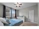 Cozy bedroom with ceiling fan and natural light, featuring carpeted floors at 9009 Savannah Julip Ln, Orlando, FL 32832