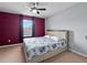 Spacious bedroom with a window and a ceiling fan, neutral colored walls at 9009 Savannah Julip Ln, Orlando, FL 32832