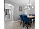 Dining area with stylish lighting and a large square table, perfect for Gathering meals at 9009 Savannah Julip Ln, Orlando, FL 32832