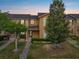 Charming townhome showcasing a meticulously landscaped yard, creating an inviting curb appeal at 9009 Savannah Julip Ln, Orlando, FL 32832
