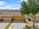 Charming townhome showcasing a well-maintained lawn, inviting garage, and a welcoming entrance at 9009 Savannah Julip Ln, Orlando, FL 32832