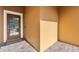 A well-lit porch and paneled front door with welcome mat on a textured brick surface at 9009 Savannah Julip Ln, Orlando, FL 32832