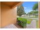Enjoy the beautiful front porch with a manicured shrub and pavers leading to the front yard at 9009 Savannah Julip Ln, Orlando, FL 32832
