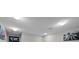 This is an upstairs hallway with white walls and recessed lighting fixtures at 9009 Savannah Julip Ln, Orlando, FL 32832